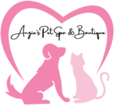A pink heart with a cat and dog in front of it.